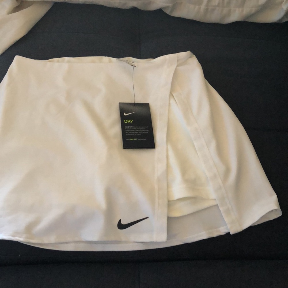 - Nike white tennis skirt with side slit. Slim fit. Brand new
